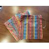 Syrian-made, silk drawstring bag. Multi-colored striped with white pattern.