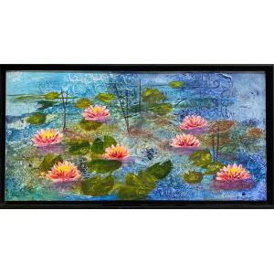 Framed mixed media piece of pink waterlilies and green lily pads on blue water