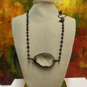 Crystal
  Pendant Eyeglass Holder by Kathy Gelfand.