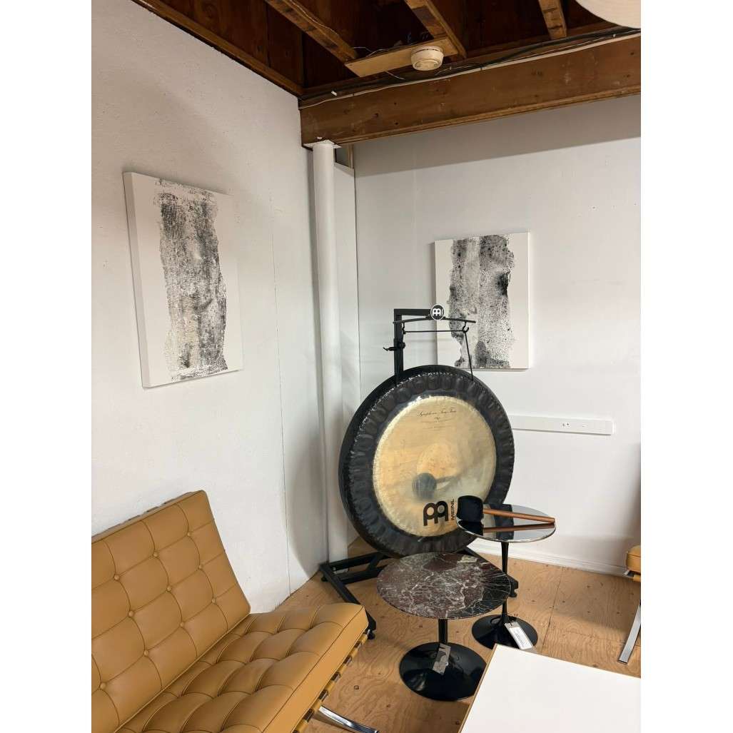 image of room with modern chairs and gong with veronique sapin art on the walls