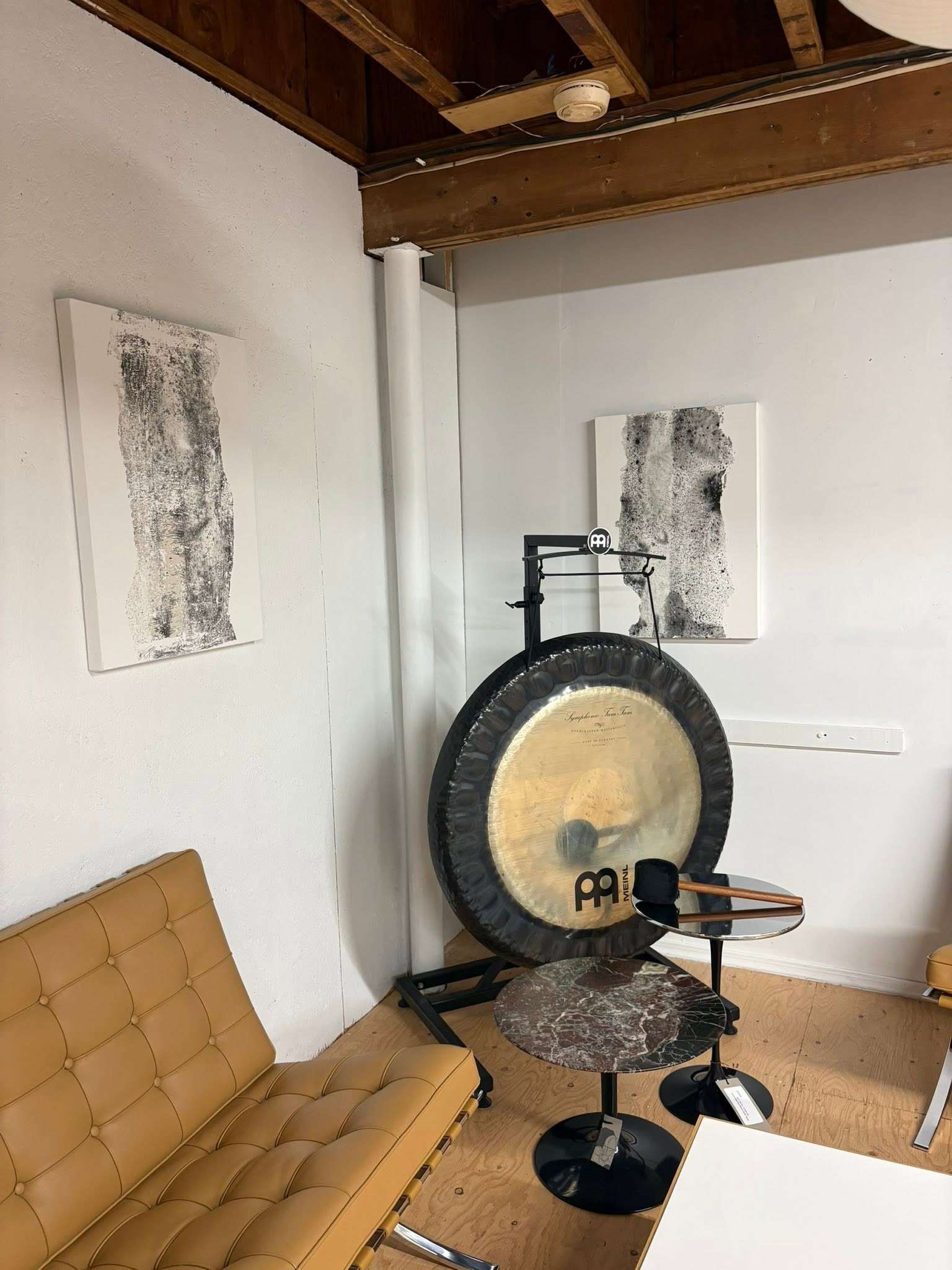 image of room with modern chairs and gong with veronique sapin art on the walls